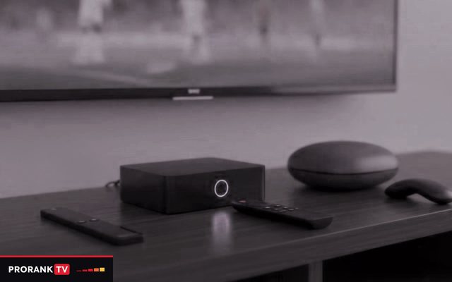 Cover for “Best IPTV box: choosing a streaming device for live TV and listening practice”: a set-top box, a round streaming box and a streaming stick with their remotes on a TV console