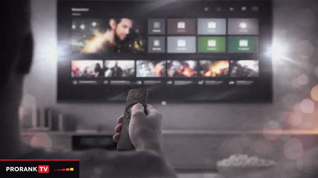 Cover for “IPTV glossary A to Z: from audio track to Xtream Codes”: a hand pointing a remote at a wall television that shows rows of titles