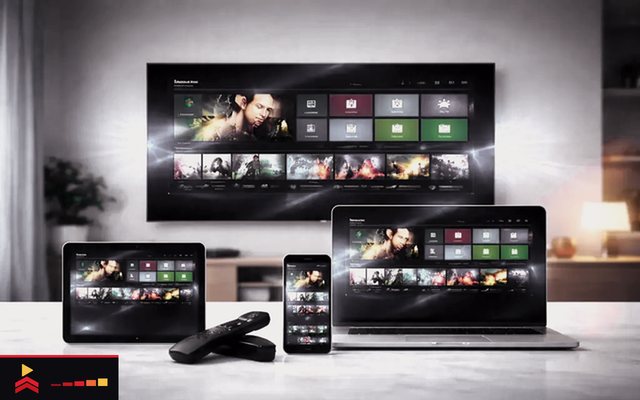 Cover for “IPTV vs OTT streaming: live channels, on-demand titles and listening practice”: a television, a laptop, a tablet and a phone showing the same channel guide, with two streaming sticks in front
