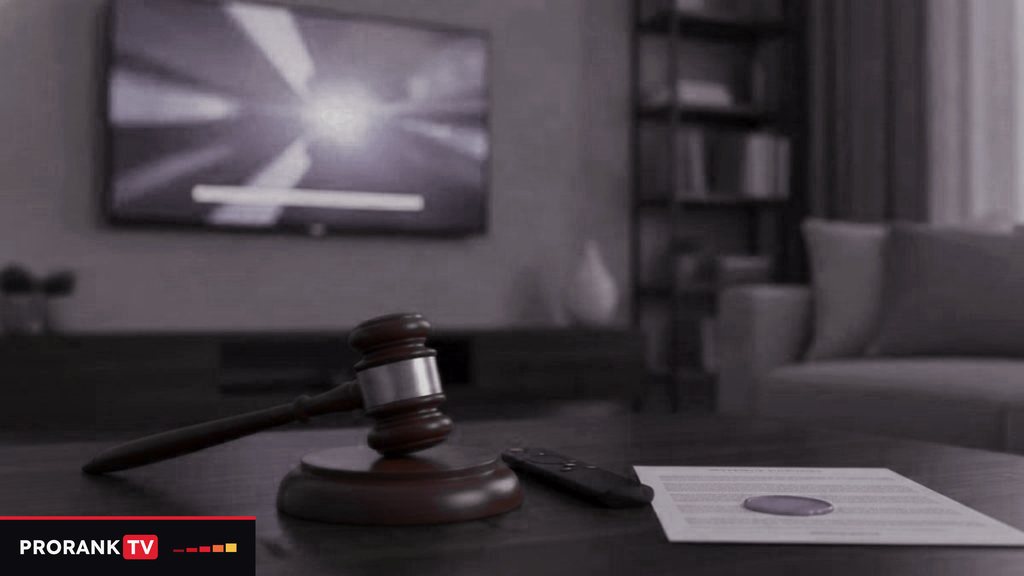 Cover for “Is IPTV legal? Rights, territories and what depends on your country”: a gavel, a remote and a printed document on a coffee table in front of a television