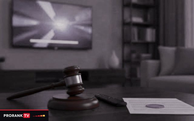 Cover for “Is IPTV legal? Rights, territories and what depends on your country”: a gavel, a remote and a printed document on a coffee table in front of a television